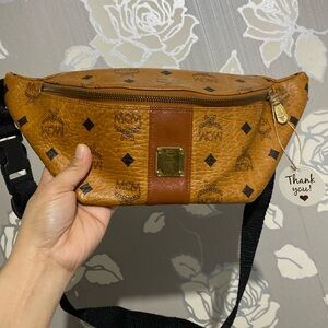 Authentic MCM belt bag. With minor scratches on the plate in front.
